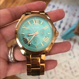 Fossil Rose gold watch with turquoise face. $80